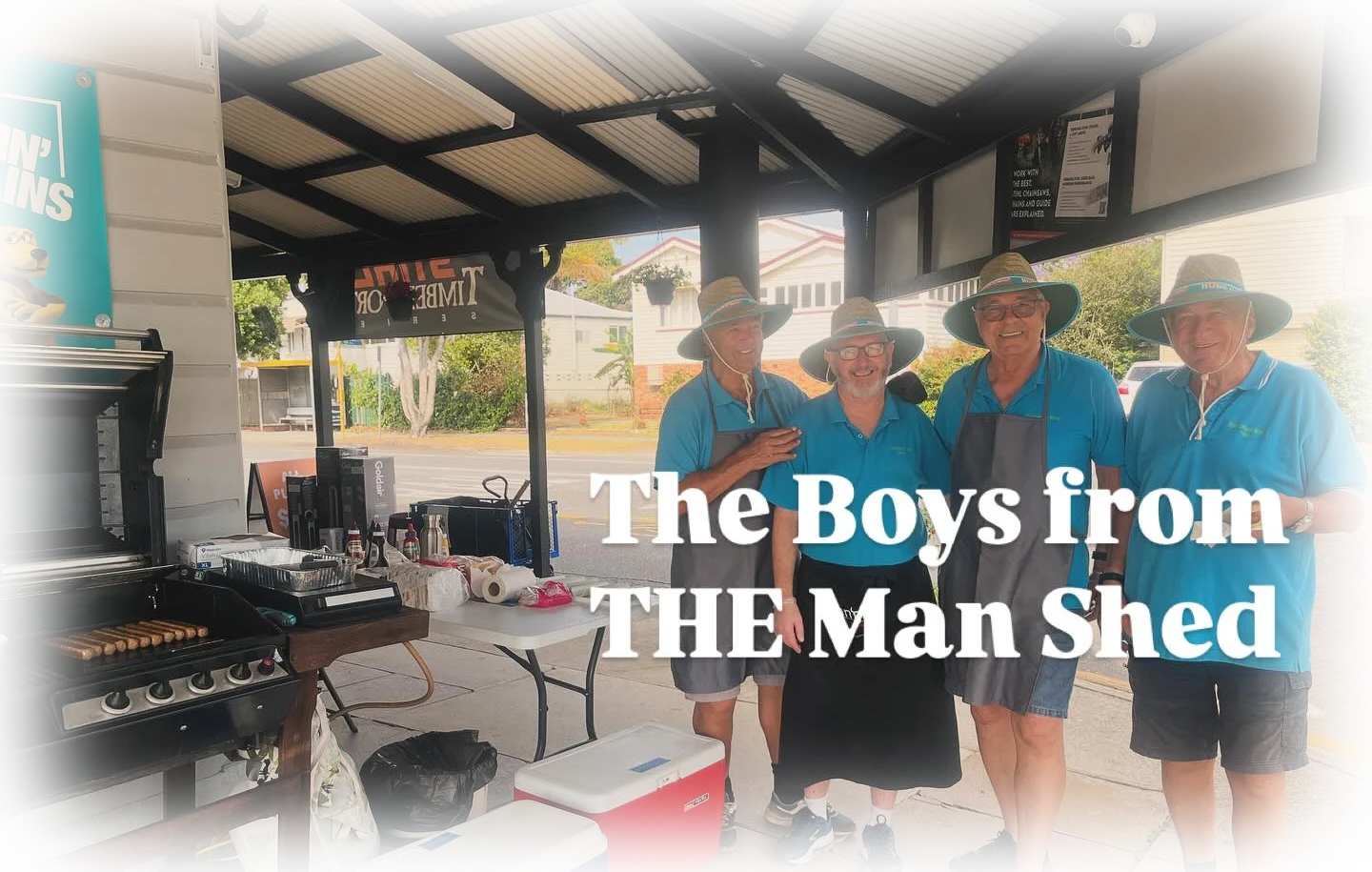 Volunteers from the Men's Shed cooking a sausage sizzle on the BBQ at Hendra Hardware